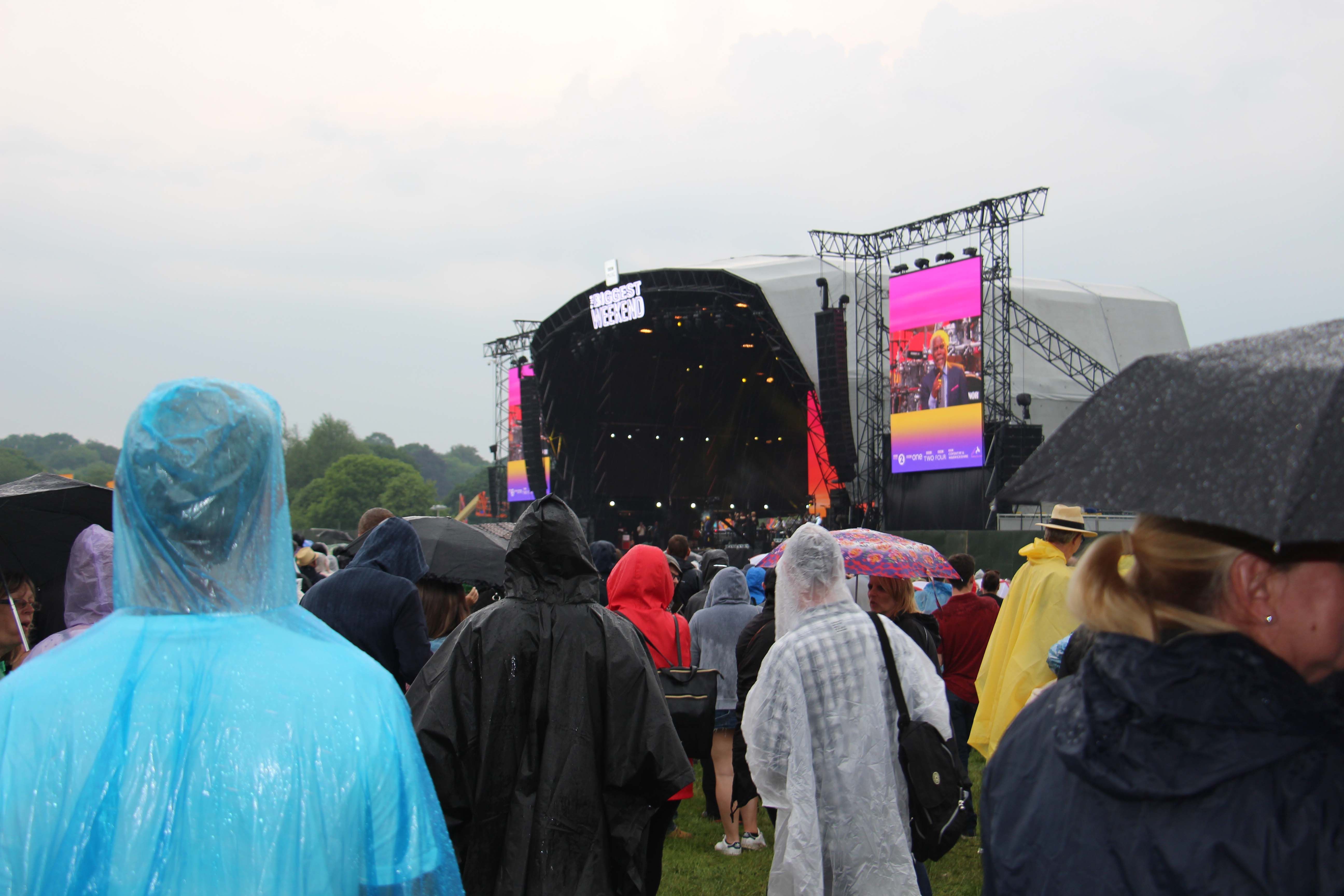 Image may contain: Back, Crowd, Umbrella, Canopy, Stage, Person, People, Human