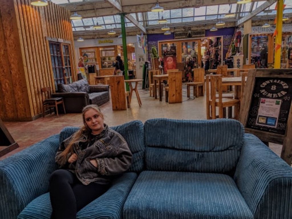 Image may contain: Home Decor, Housing, Building, Plywood, Room, Restaurant, Indoors, Wood, Person, Human, Chair, Couch, Furniture