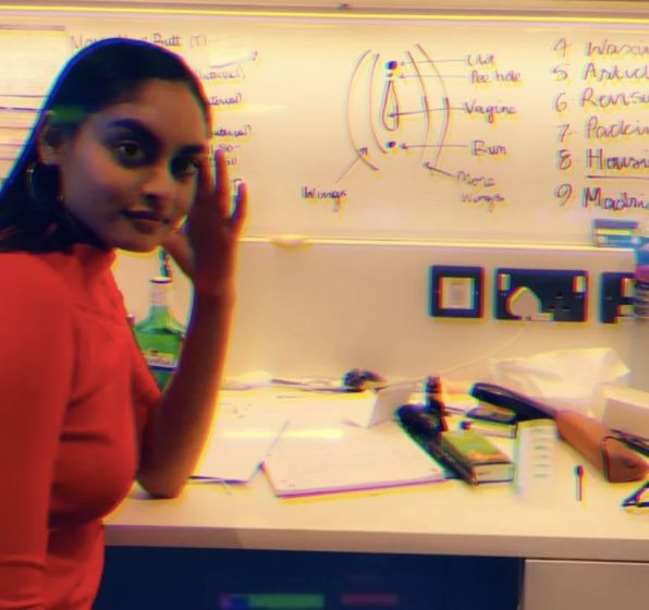 Image may contain: Desk, Table, Furniture, Person, Human, White Board