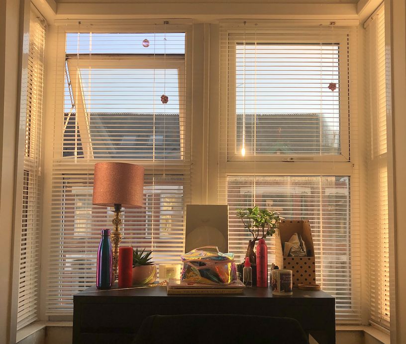 Image may contain: Interior Design, Indoors, Picture Window, Table, Furniture, Lamp, Curtain, Window Shade, Window, Home Decor