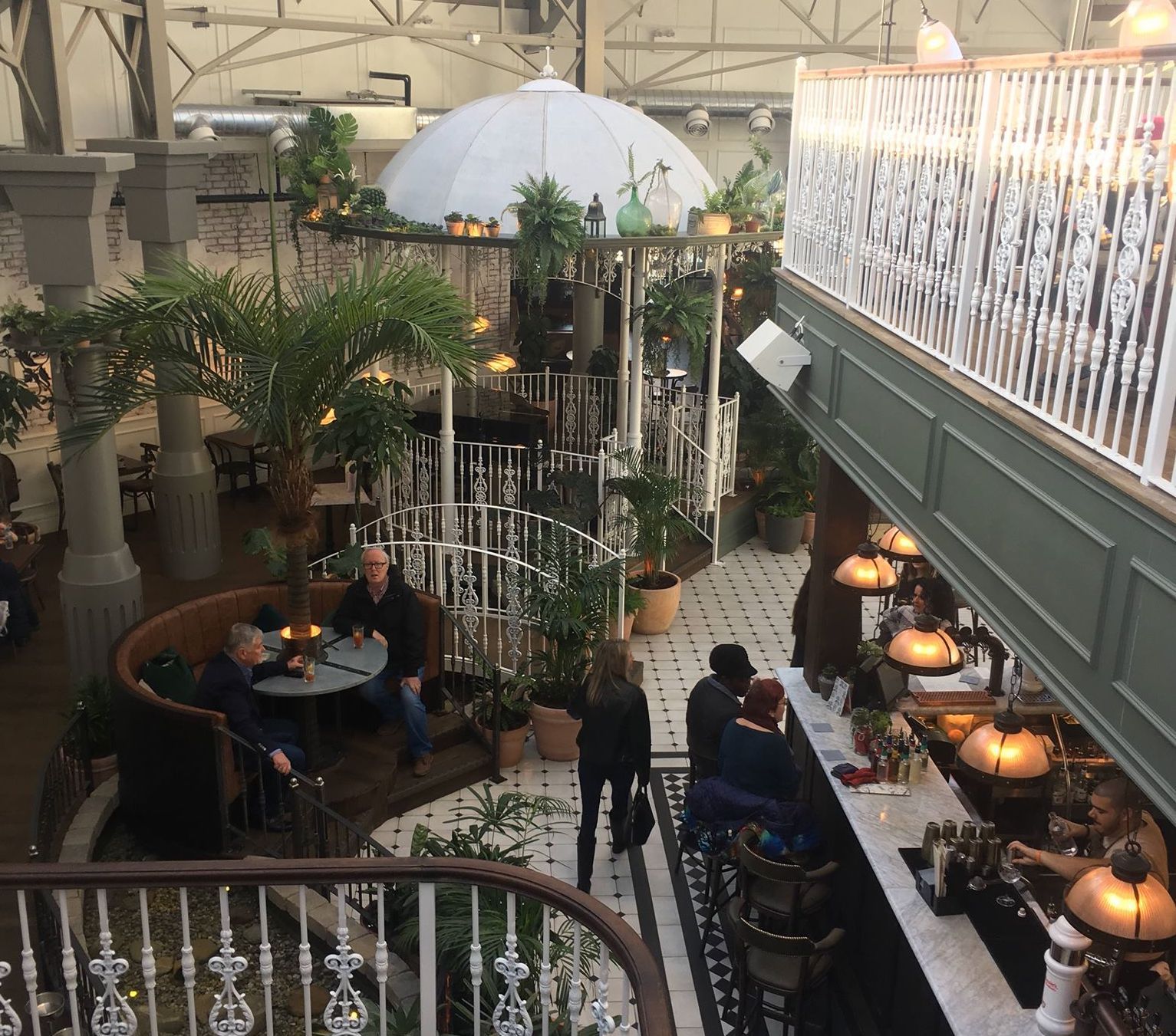 Image may contain: Railing, Cafeteria, Cafe, Patio, Handrail, Banister, Food, Food Court, Person, Human, Restaurant