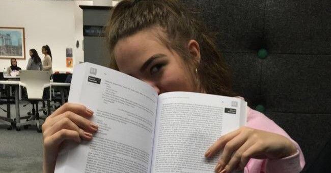 Image may contain: Book, Person, Human, Reading