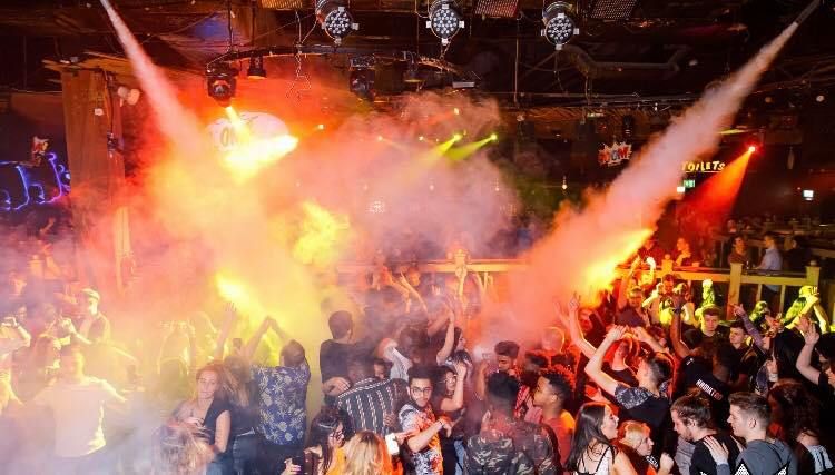 Image may contain: Flame, Bonfire, Fire, Disco, Night Club, Club, Person, Human