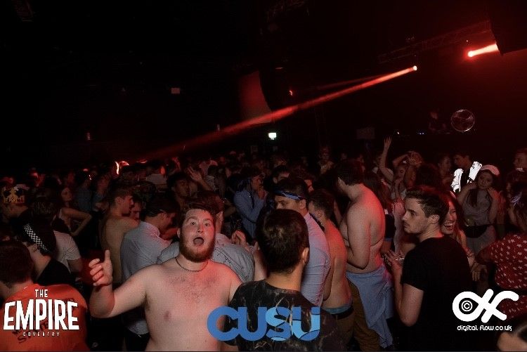Image may contain: Face, Disco, Crowd, Audience, Night Club, Night Life, Party, Club, Interior Design, Indoors, Human, Person