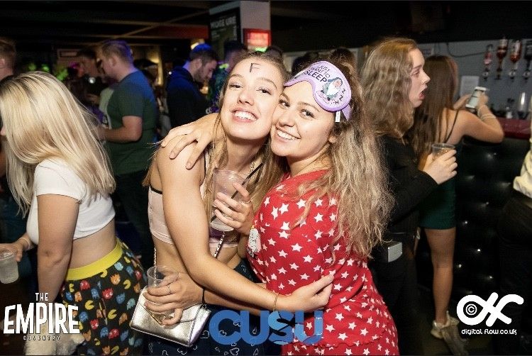 Image may contain: Female, Smile, Night Life, Clothing, Apparel, Face, Night Club, Club, Party, Person, Human