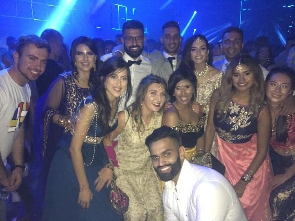 Image may contain: People, Night Life, Photo, Portrait, Photography, Night Club, Head, Female, Dress, Club, Clothing, Apparel, Smile, Face, Party, Person, Human