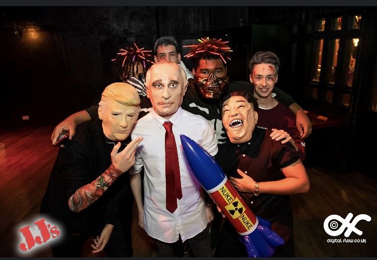 Image may contain: Arm, Night Life, Portrait, Photography, Photo, People, Tattoo, Smile, Apparel, Clothing, Party, Head, Costume, Face, Person, Human, Tie, Accessories, Accessory, Skin