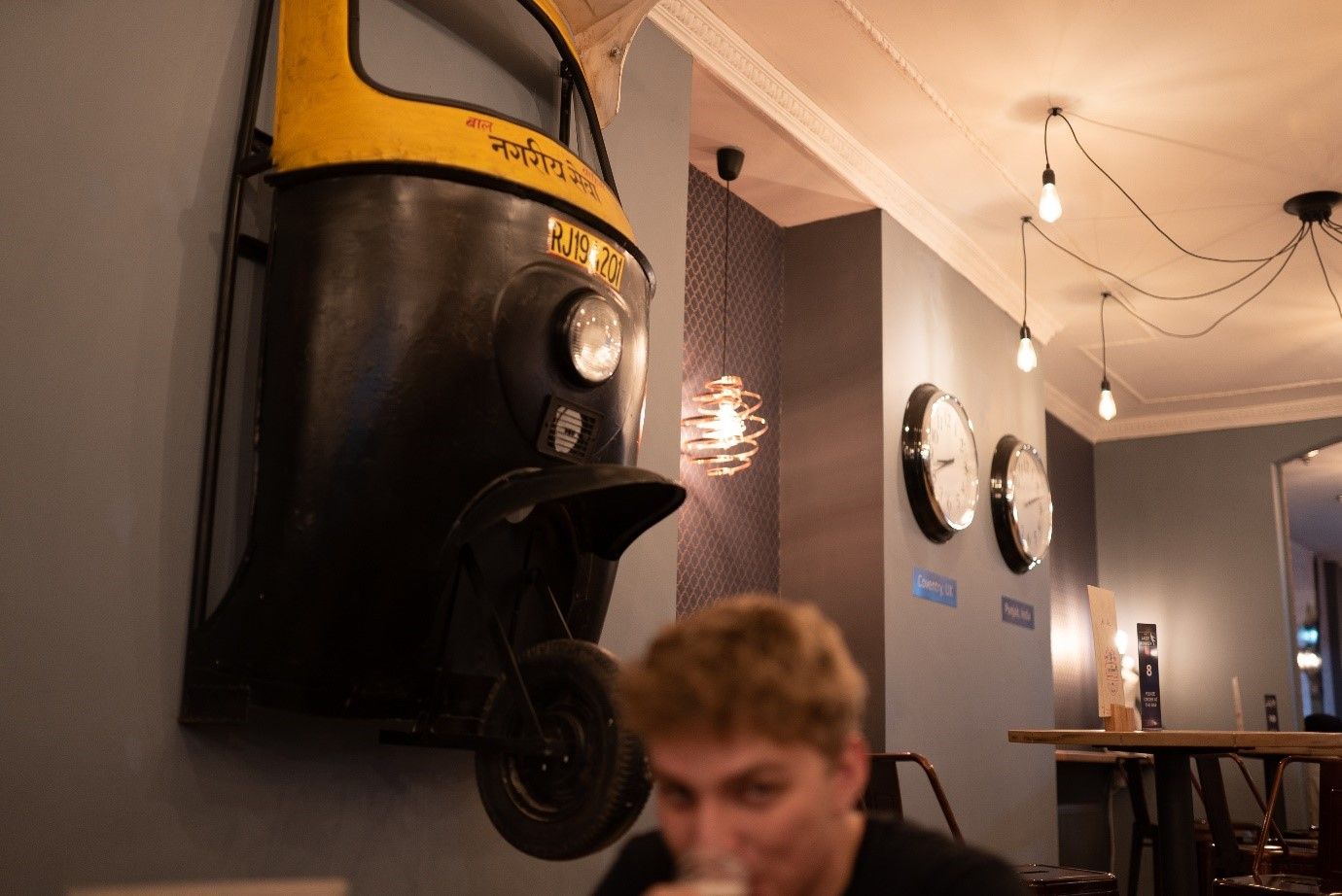 Image may contain: Cafe, Restaurant, Wheel, Machine, Person, Human