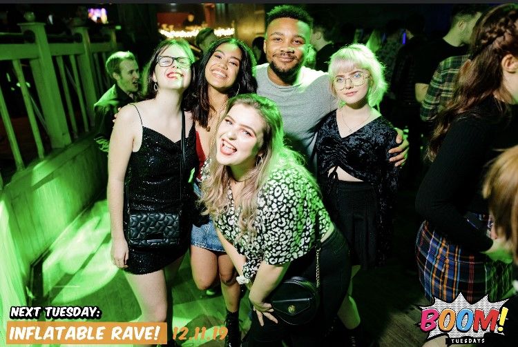 Image may contain: Outdoors, Portrait, Photography, Photo, People, Costume, Smile, Dress, Female, Night Club, Green, Clothing, Apparel, Club, Lighting, Face, Party, Human, Person