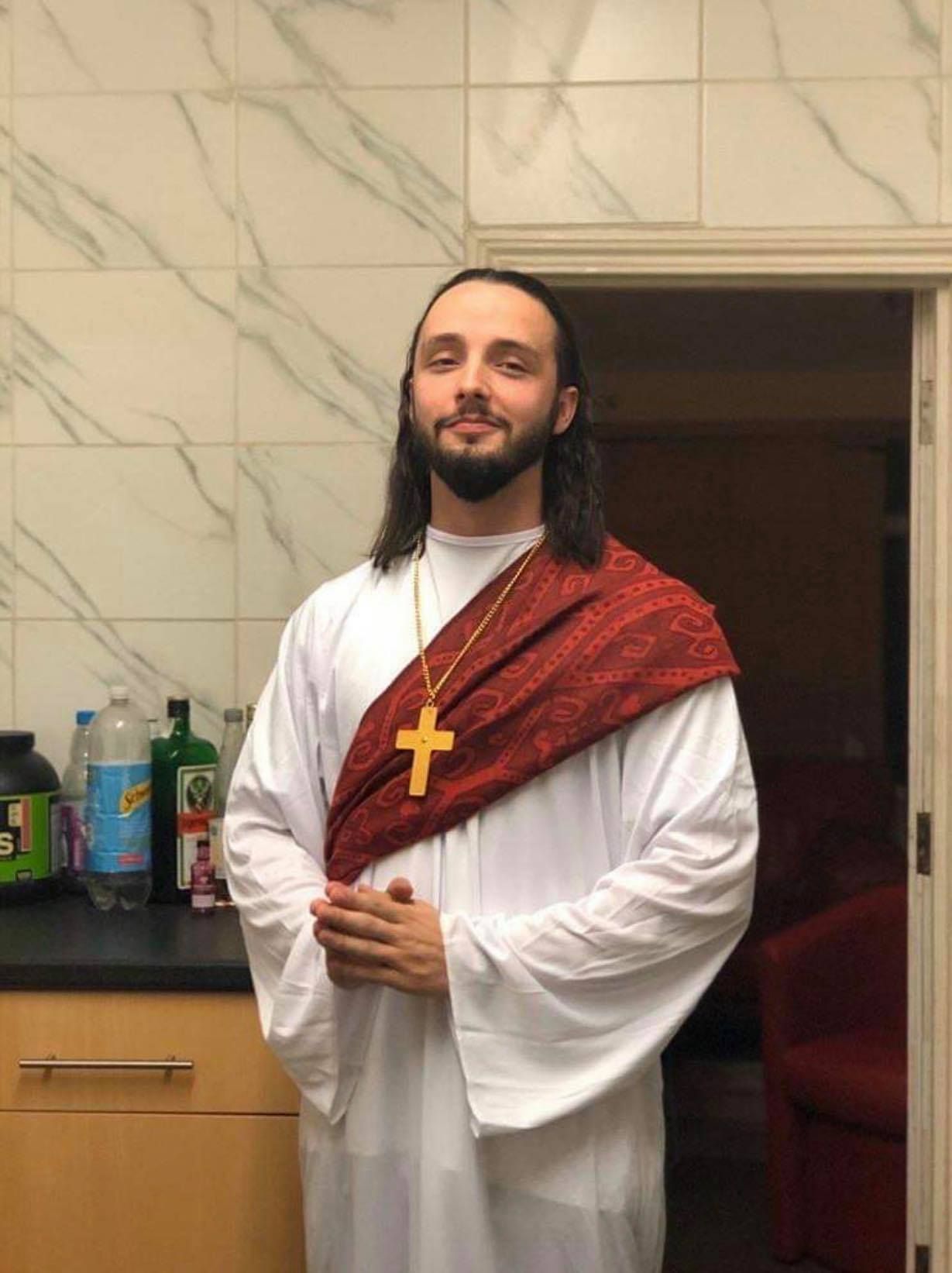 Image may contain: Skin, Clothing, Apparel, Bishop, Priest, Person, Human