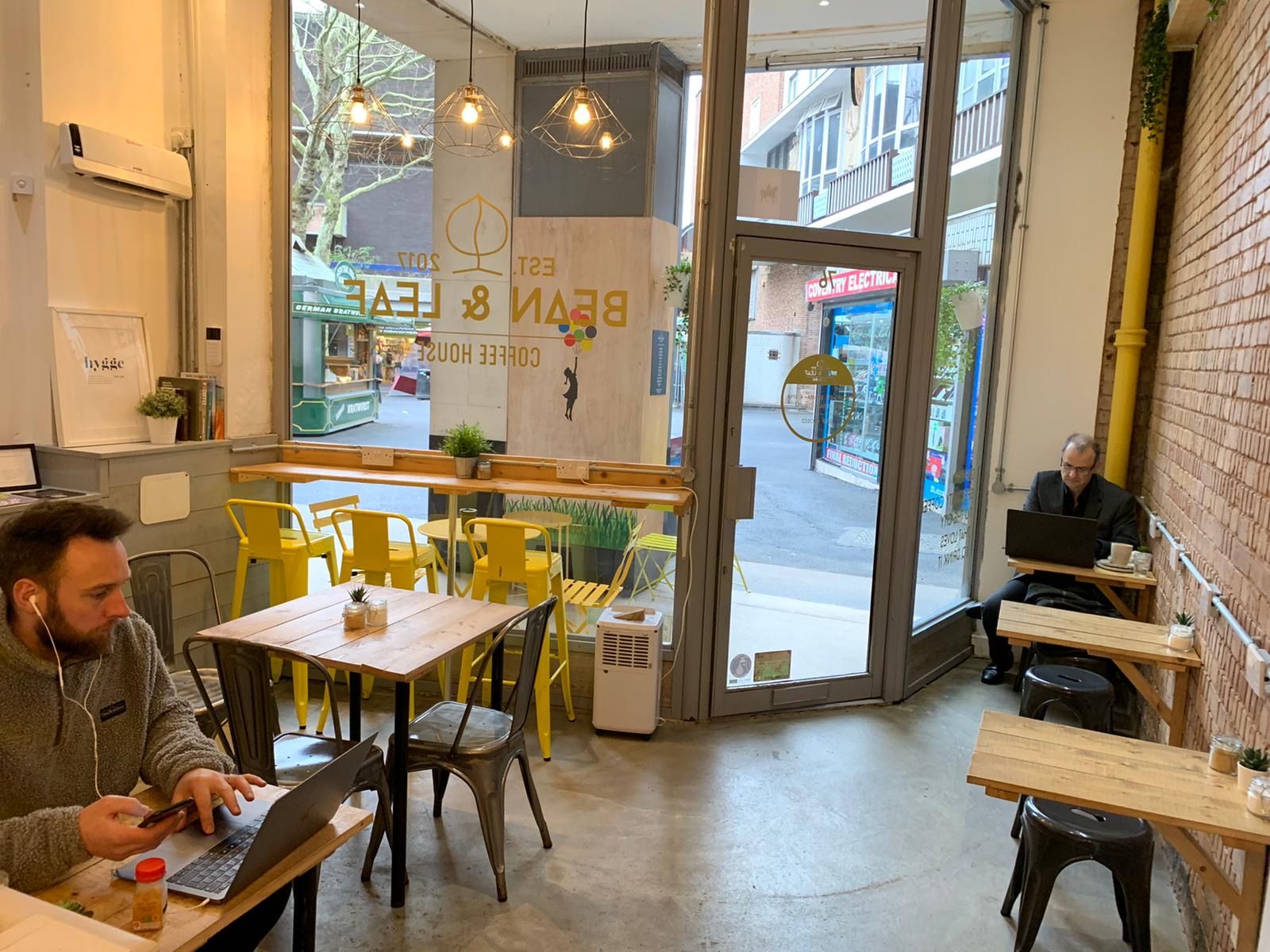 Image may contain: Floor, Flooring, Plywood, Cafeteria, Wood, Cafe, Person, Human, Restaurant, Chair, Furniture