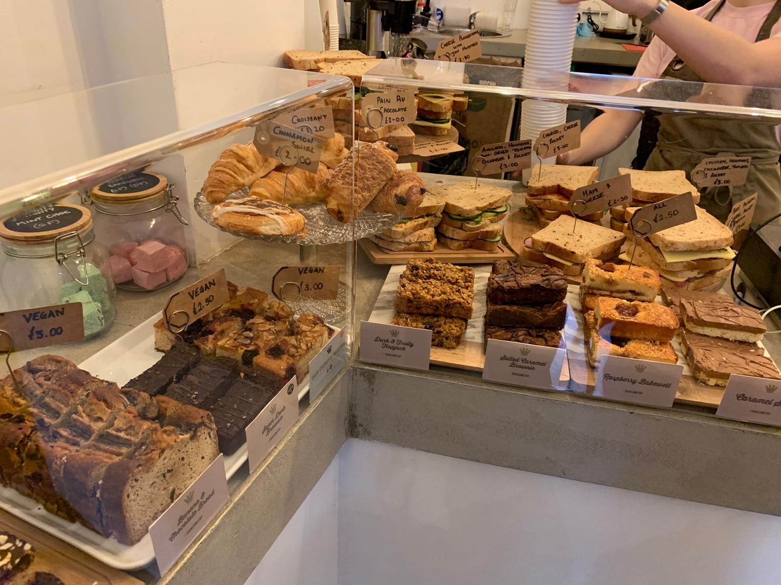 Image may contain: Food, Person, Human, Bakery, Shop