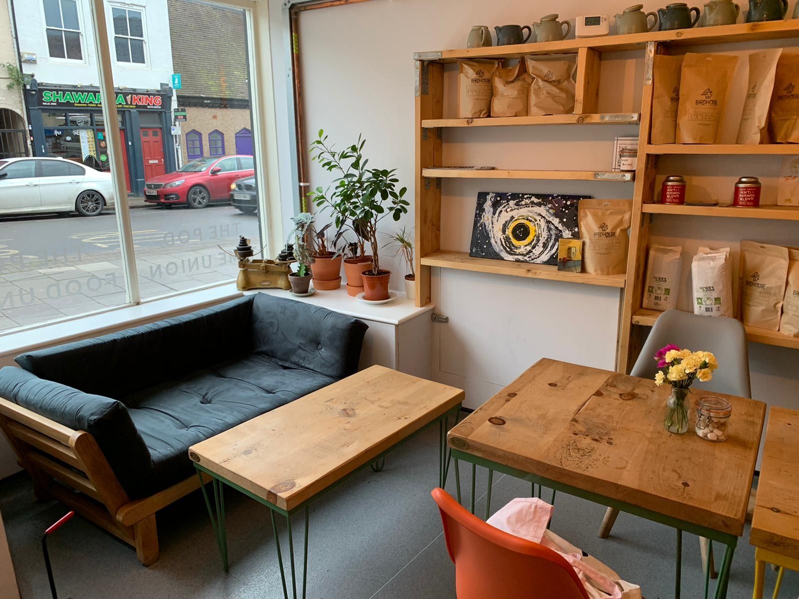Image may contain: Living Room, Room, Flooring, Desk, Housing, Building, Hardwood, Wheel, Machine, Interior Design, Indoors, Table, Shelf, Automobile, Transportation, Car, Vehicle, Plywood, Wood, Chair, Furniture