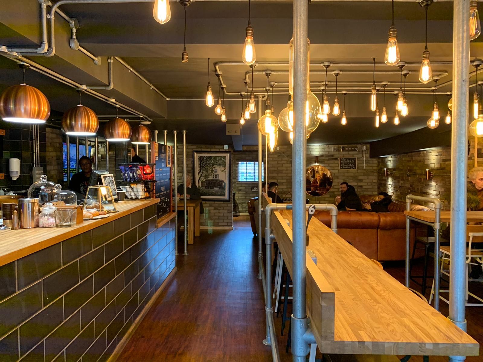 Image may contain: Meal, Food, Cafe, Cafeteria, Hardwood, Plywood, Human, Person, Restaurant, Wood