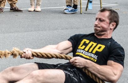Tom's training includes flipping giant tyres and dragging heavy barrels. Tom's training includes flipping giant tyres and dragging heavy barrels.