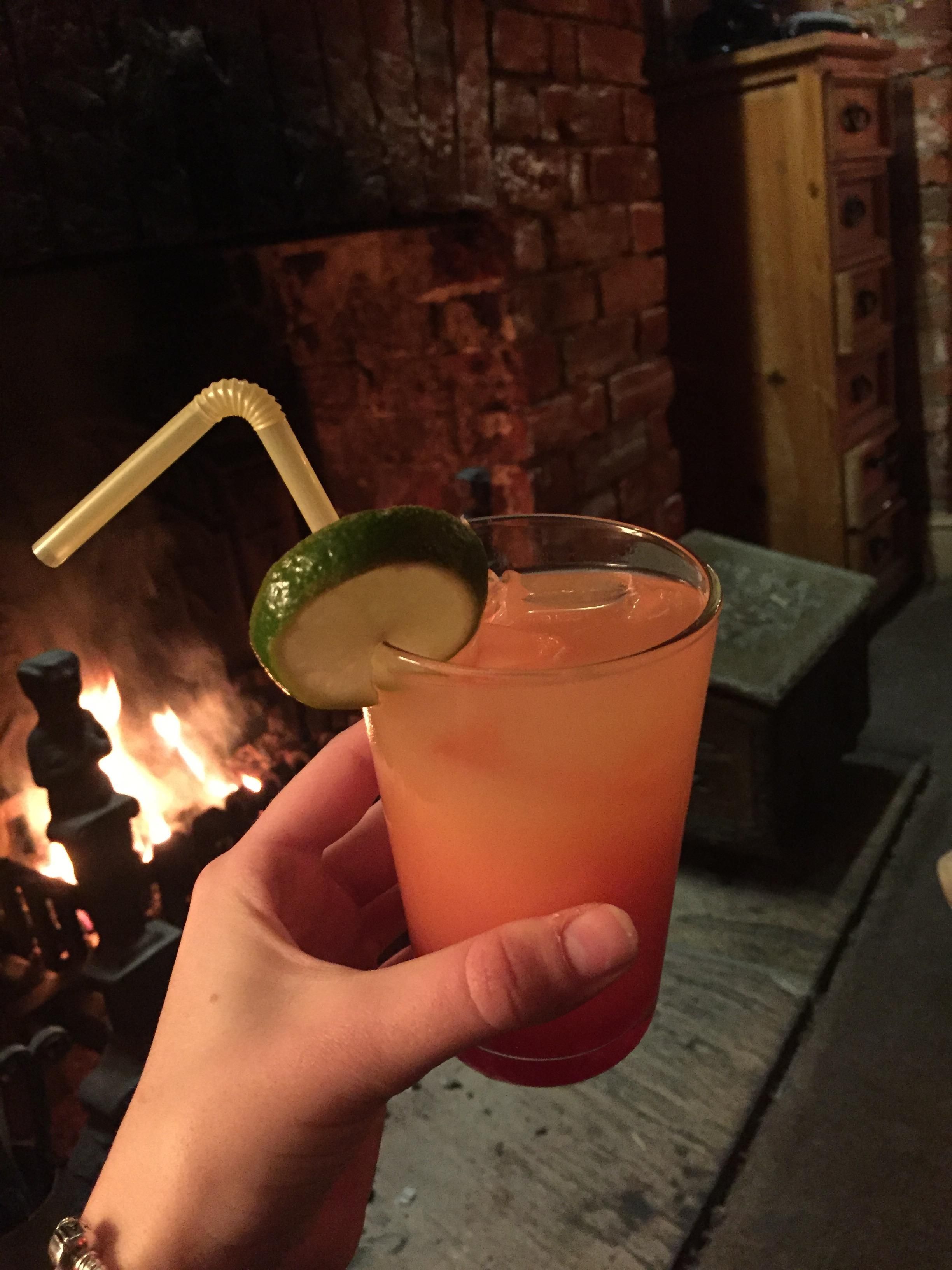 Image may contain: Fire, Mojito, Drink, Cocktail, Beverage, Alcohol, Person, People, Human