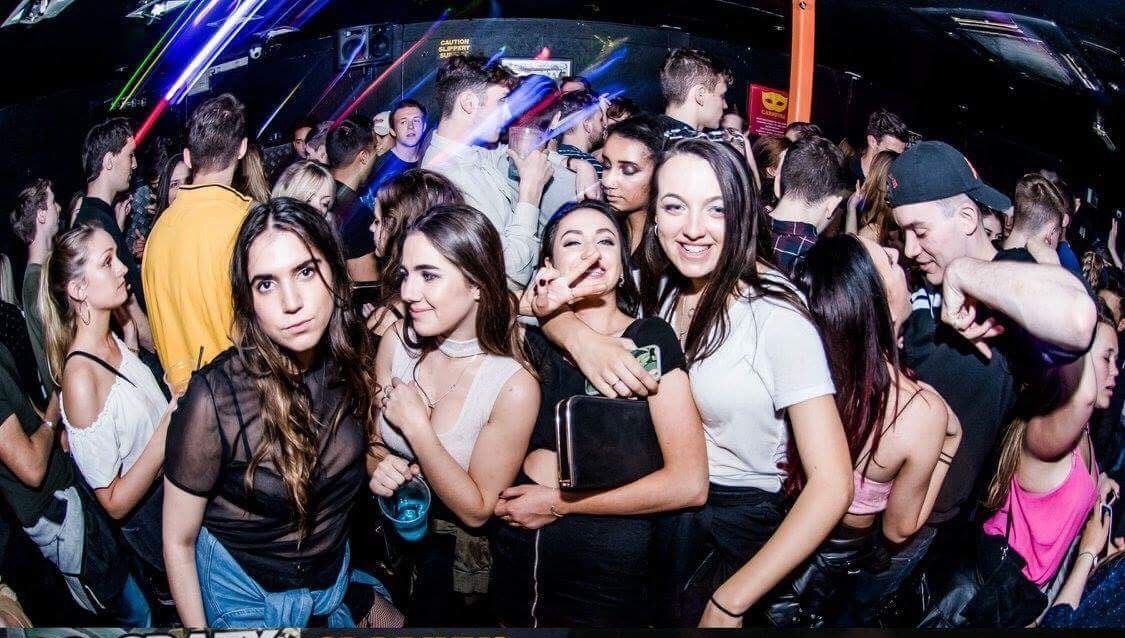 Image may contain: Night Life, Night Club, Club, Crowd, Party, Make Out, Person, People, Human