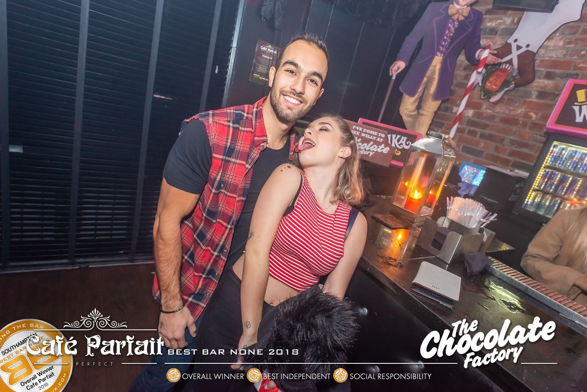 Image may contain: Bar Counter, Pub, Night Club, Club, Human, Person