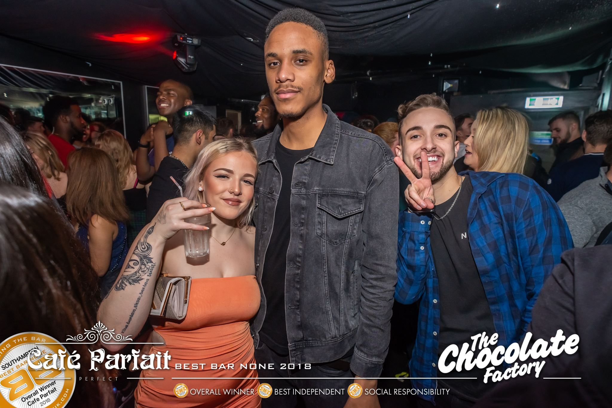 Image may contain: Coat, Clothing, Jacket, Apparel, Bar Counter, Pub, Dating, Club, Skin, Human, Person