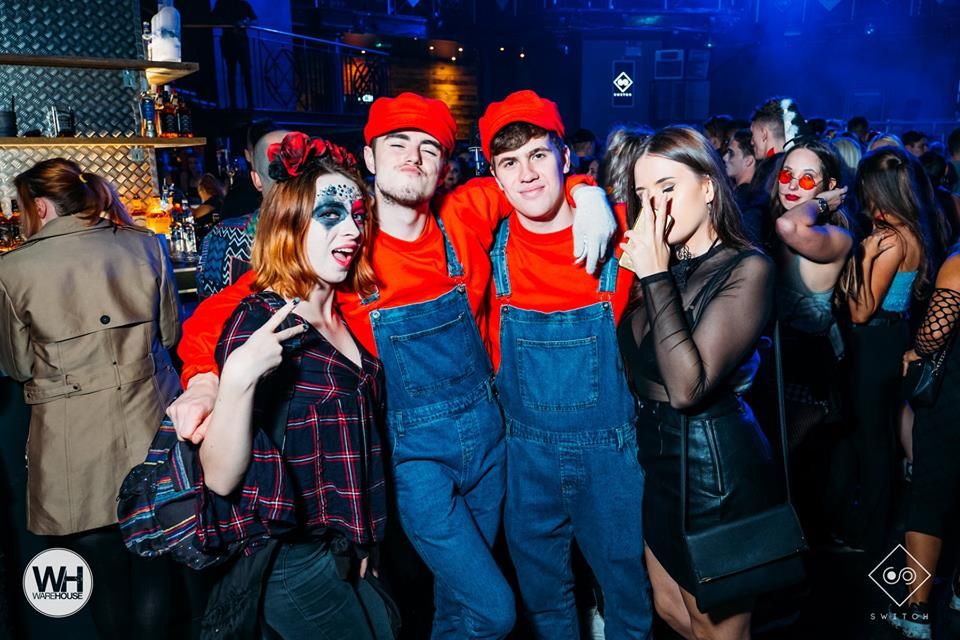 Image may contain: Disco, Pants, Clothing, Apparel, Night Life, Party, Night Club, Club, Person, Human
