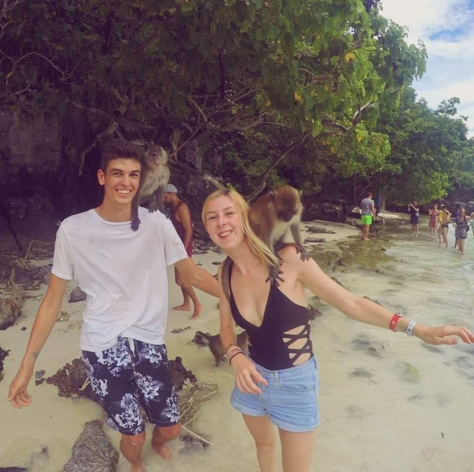 Image may contain: Smile, People, Summer, Vegetation, Sand, Woman, Beach, Coast, Girl, Play, Rock, Shoreline, Ocean, Sea, Water, Face, Plant, Tree, Nature, Vacation, Outdoors, Female, Human, Person, Clothing, Apparel, Shorts