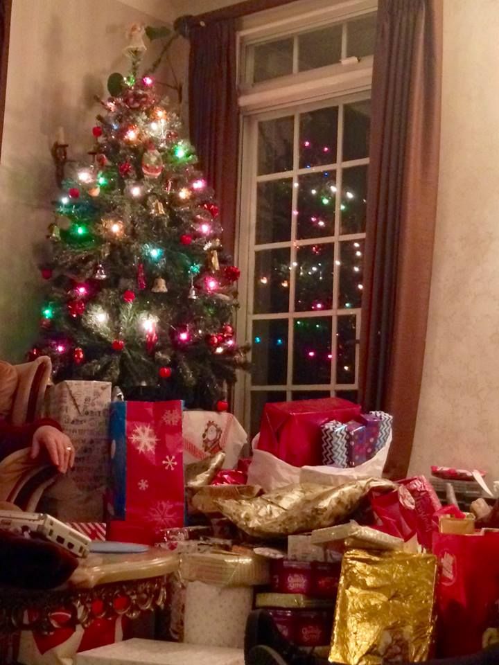 Image may contain: Table, Fir, Abies, Cushion, Chair, Furniture, Gift, Room, Living Room, Indoors, Ornament, Christmas Tree, Lighting, Plant, Tree