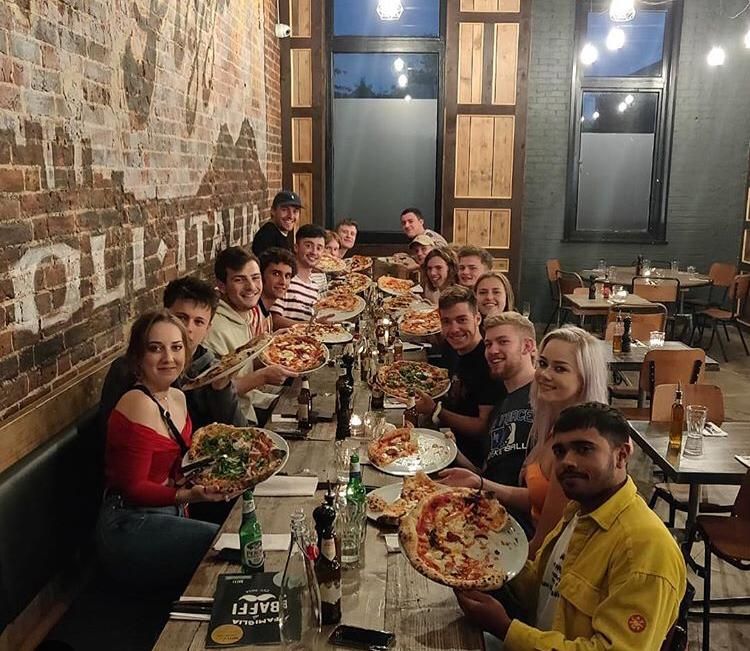 Image may contain: Food Court, Face, People, Dining Room, Supper, Dinner, Cafeteria, Chair, Room, Indoors, Dish, Lunch, Dining Table, Table, Furniture, Meal, Food, Person, Human, Restaurant