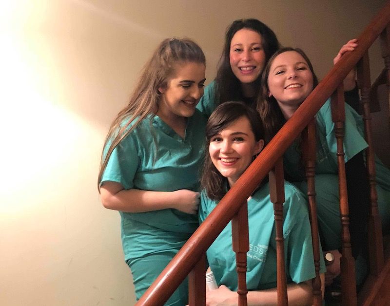 Image may contain: Girl, Laughing, Staircase, Photo, Photography, Portrait, Apparel, Clothing, Head, Furniture, People, Railing, Female, Smile, Person, Face, Human, Banister, Handrail