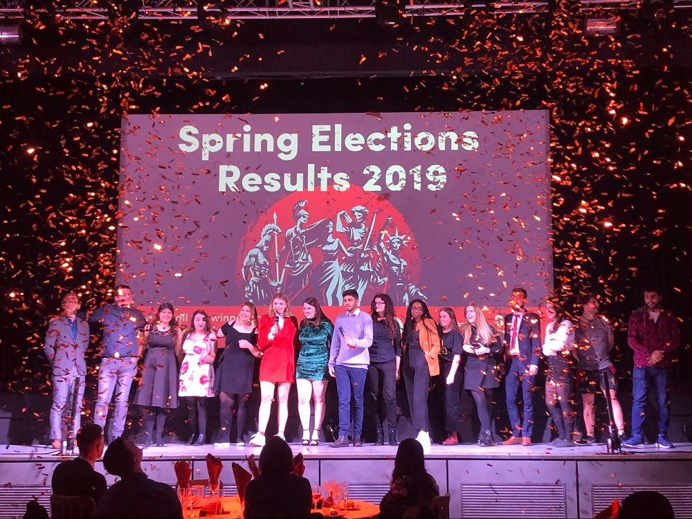 Image may contain: Confetti, Paper, Person, Human, Stage