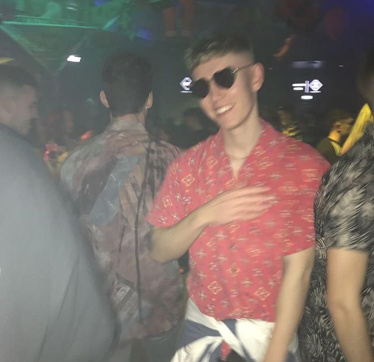 Image may contain: Disco, Clothing, Apparel, Pillow, Party, Cushion, Night Club, Club, Accessory, Sunglasses, Accessories, Person, Human