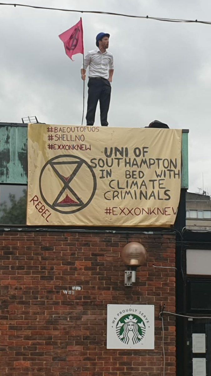 Image may contain: Alphabet, Brick, Person, Human, Banner, Text
