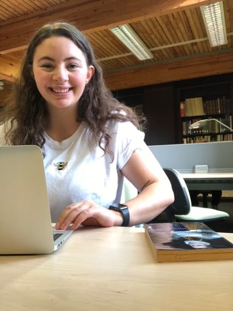 Image may contain: Girl, Desk, Dining Table, Room, Female, Chair, Face, Indoors, Table, Laptop, Tabletop, Computer, Pc, Electronics, Furniture, Person, Human