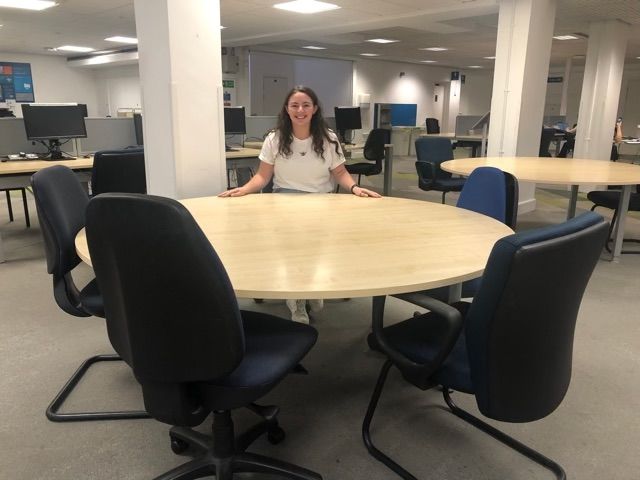 Image may contain: Meeting Room, Conference Room, Room, Office, Person, Human, Indoors, Furniture, Chair