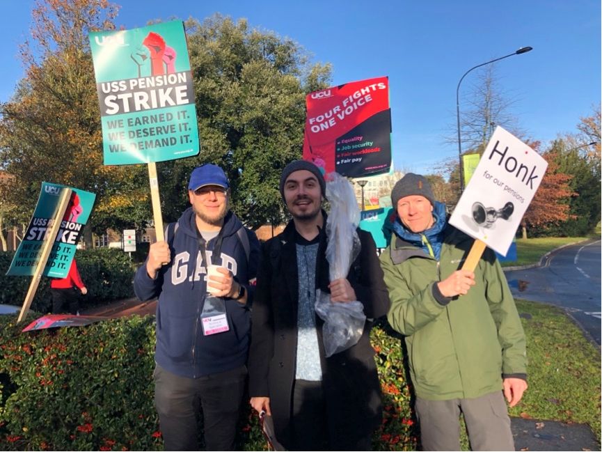 Image may contain: Jeans, Denim, People, Protest, Face, Word, Coat, Tree, Pants, Crowd, Vegetation, Plant, Parade, Banner, Label, Text, Person, Human, Apparel, Clothing