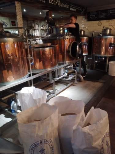 Image may contain: Human, Person, Brewery, Factory, Building