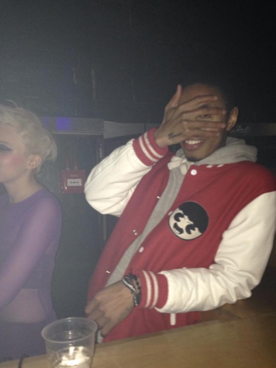 DJ tryna be coy whilst rockin' the sports vibe