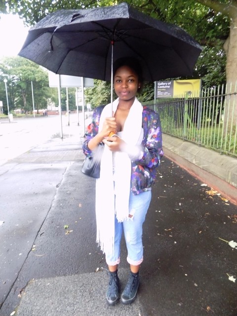 Audrey looks fabulous in this bold jacket, showing us how to still be stylish despite the rain.