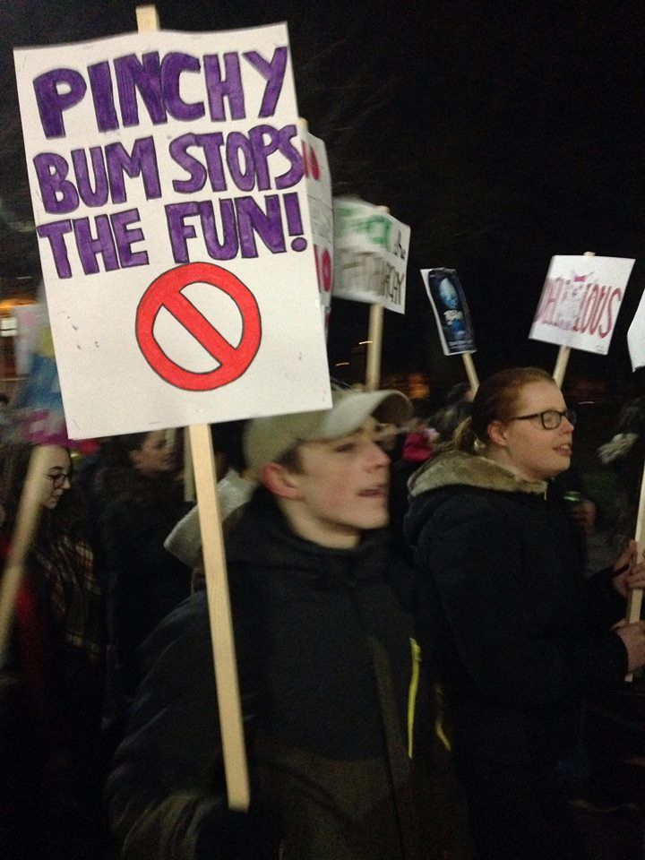 Image may contain: Book, People, Person, Parade, Human, Crowd