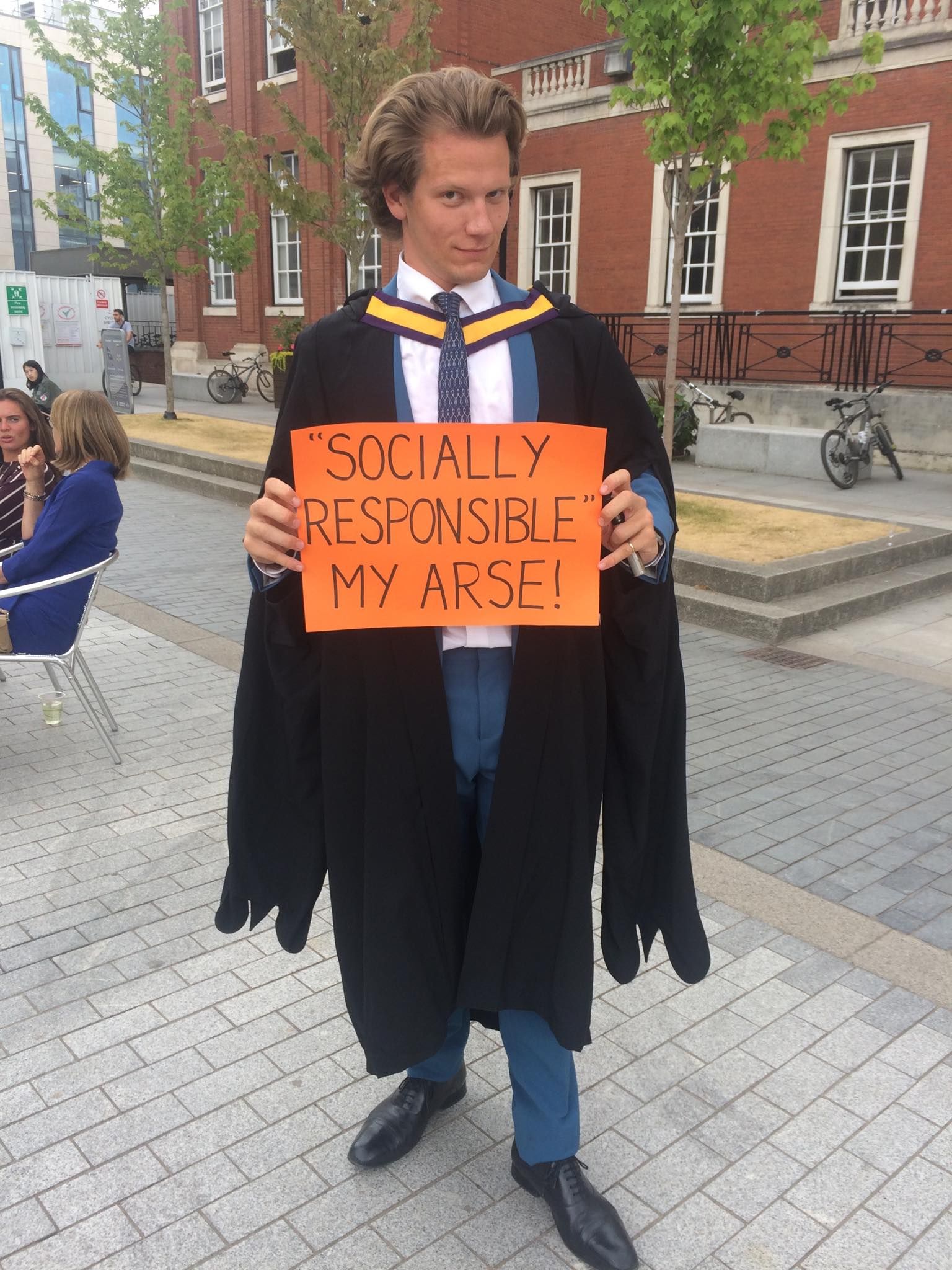 Image may contain: Bench, Brick, Graduation, Person, People, Human