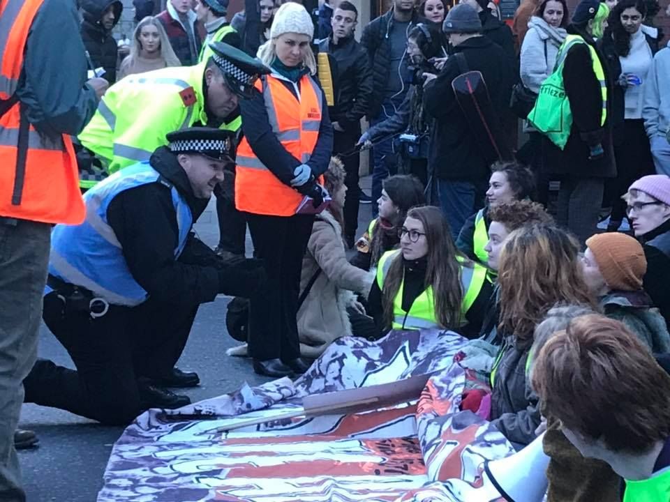 Image may contain: Police, Parade, People, Helmet, Clothing, Apparel, Crowd, Human, Person