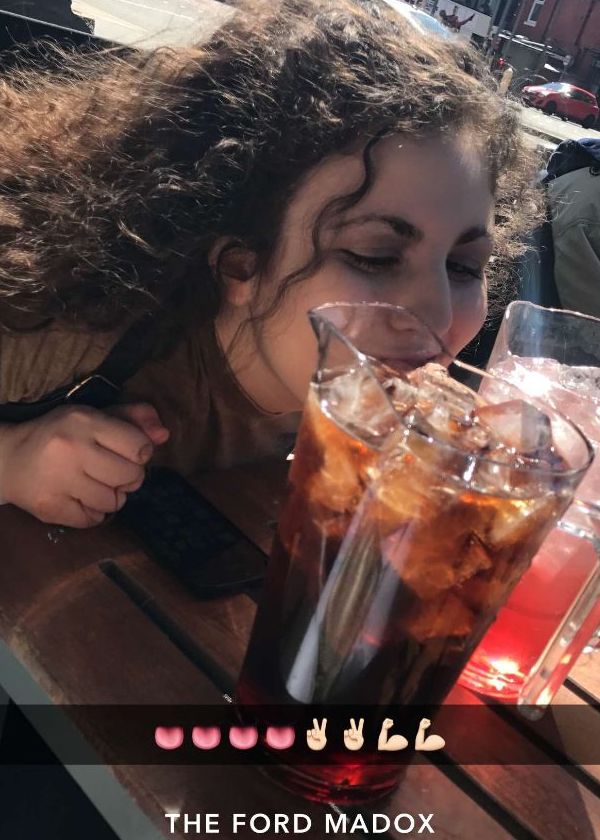 Image may contain: Soda, Drinking, Pottery, Jar, Vase, Potted Plant, Outdoors, Furniture, Chair, Plant, Face, Glass, Cocktail, Alcohol, Teen, Woman, Child, Kid, Girl, Blonde, Female, Human, Person, Drink, Beverage