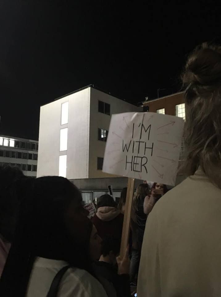 Image may contain: Face, Text, Lighting, Parade, Protest, Crowd, Word, Human, Person