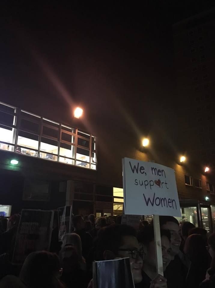 Image may contain: People, Light, Flare, Text, Protest, Parade, Crowd, Pedestrian, Human, Person