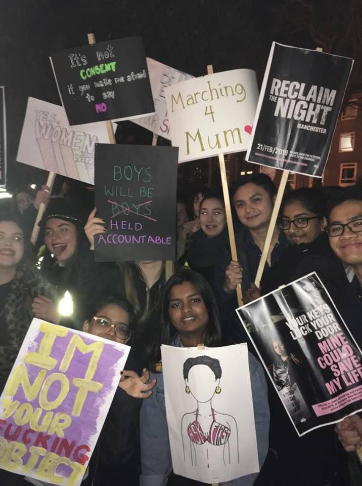 Image may contain: Vehicle, Transportation, People, Protest, Parade, Glasses, Accessory, Accessories, Text, Crowd, Person, Human