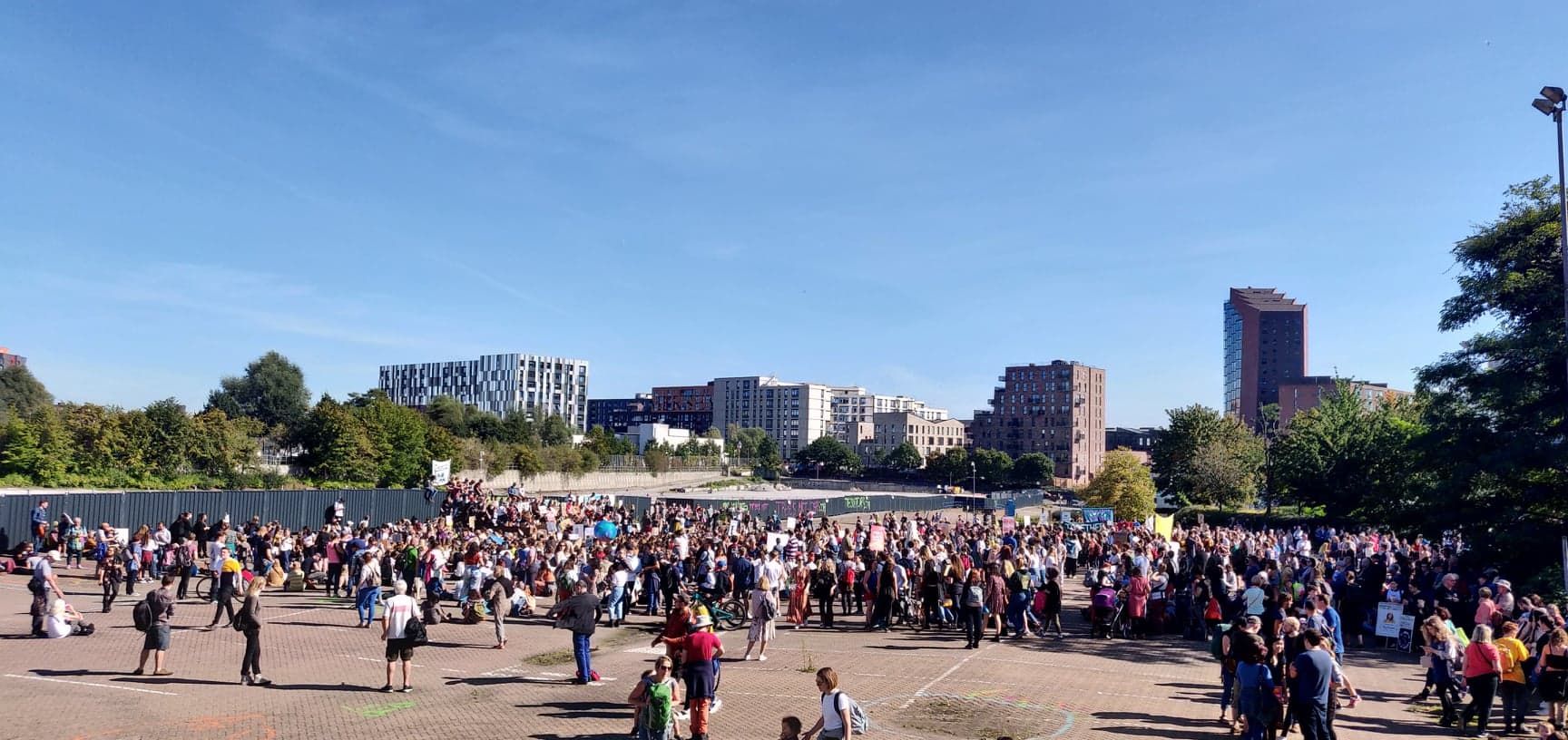 Image may contain: Audience, Pedestrian, Festival, Architecture, Crowd, Human, Person, Town, Downtown, Building, Urban, City