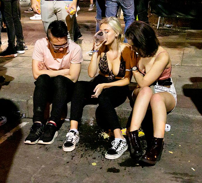 Image may contain: Crowd, Pants, Child, Blonde, Kid, Girl, Teen, Woman, Female, Sitting, Person, Human, Footwear, Shoe, Clothing, Apparel