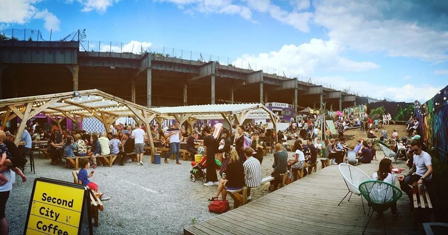 Image may contain: Dock, Port, Pier, Water, Waterfront, Shop, Market, Bazaar, Crowd, Chair, Furniture, Human, Person