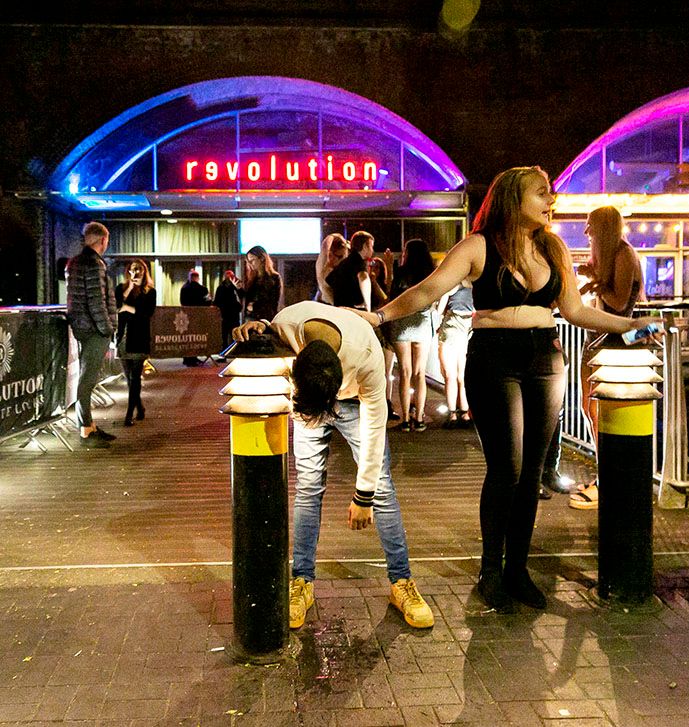 Image may contain: Jeans, Denim, Path, Night Life, Pedestrian, Pants, Person, Human, Clothing, Footwear, Shoe, Apparel