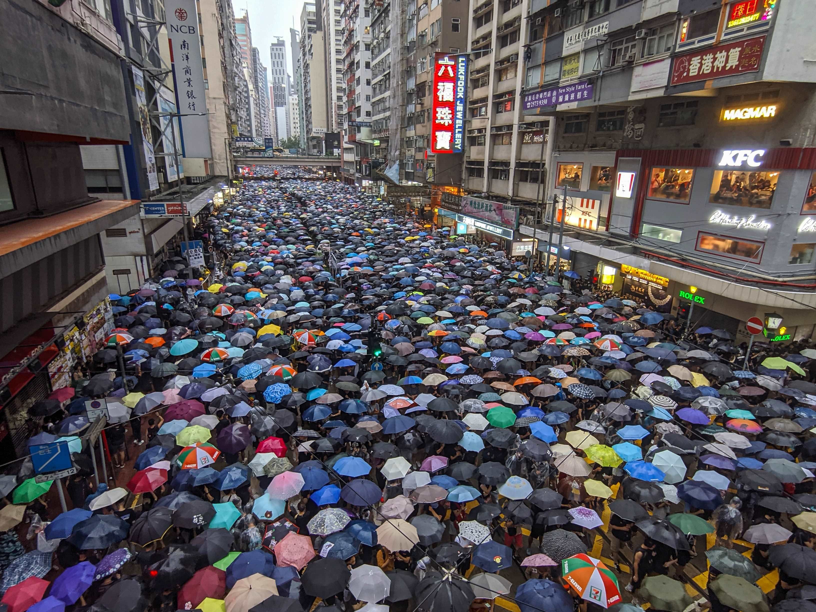 Image may contain: Pedestrian, Crowd, Town, Building, City, Urban, Metropolis
