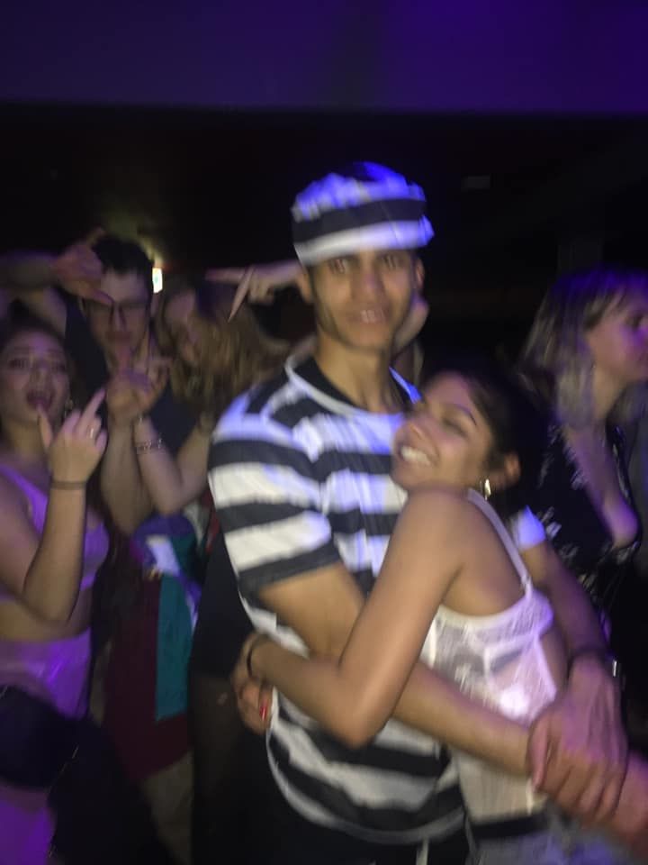 Image may contain: Crowd, Helmet, Leisure Activities, Apparel, Clothing, Hat, Party, Night Club, Club, Human, Person, Night Life